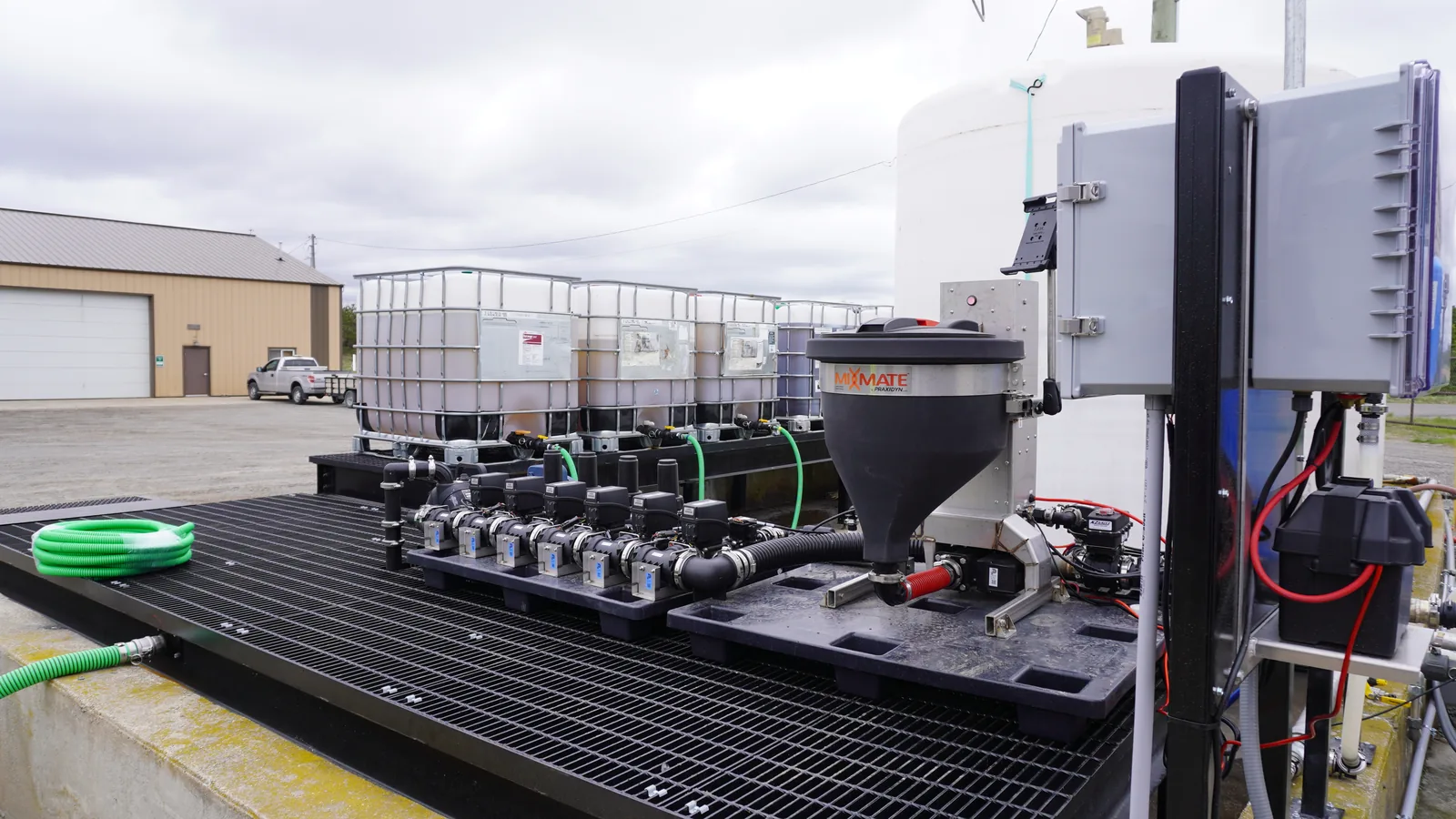 Fusion Inductor on an outdoor containment pad with a tote row, a water treatment install