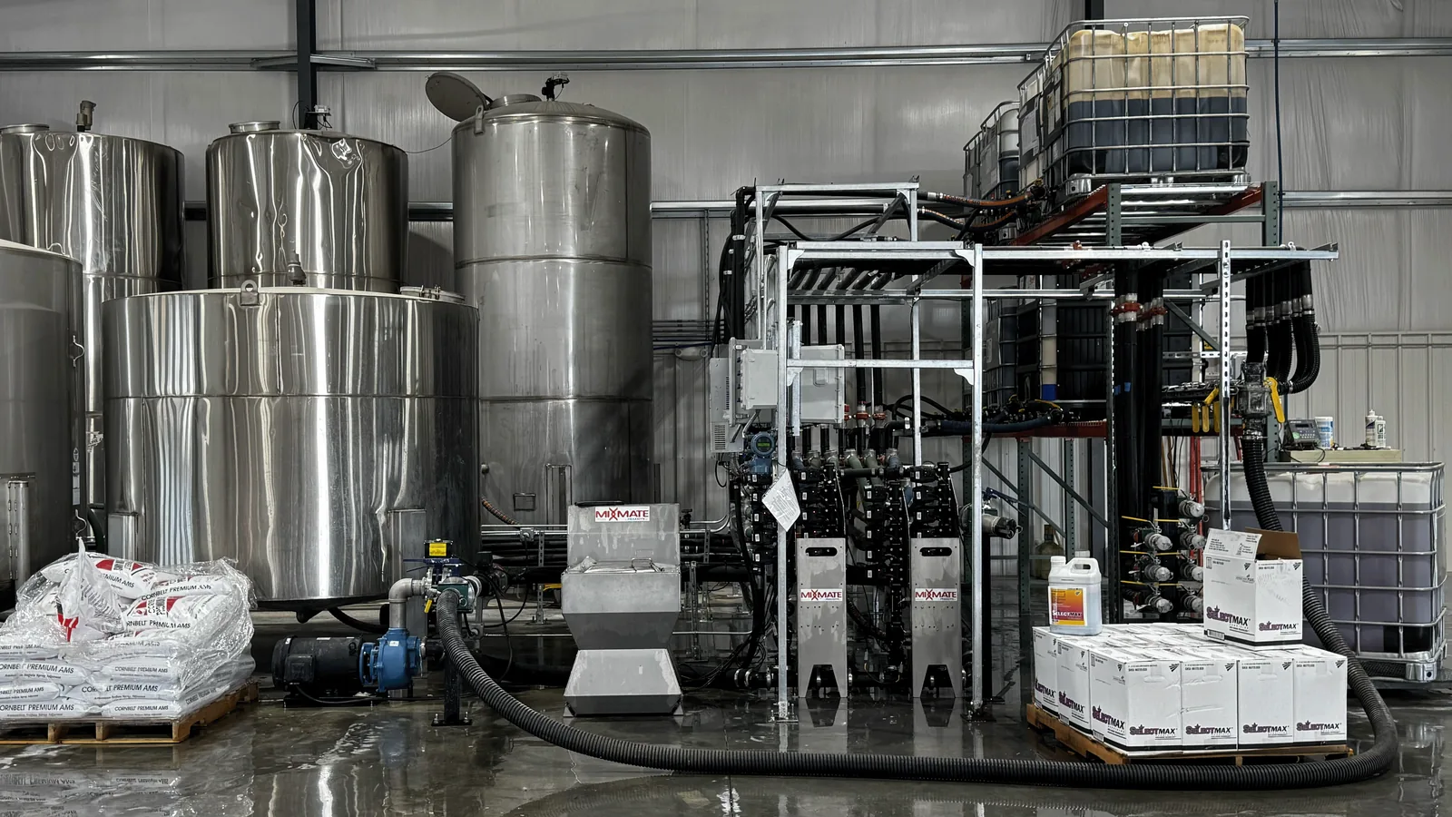 Full-scale retail plant: Pro Inductor, twin flow stacks, stainless bulk tanks, and tote rack