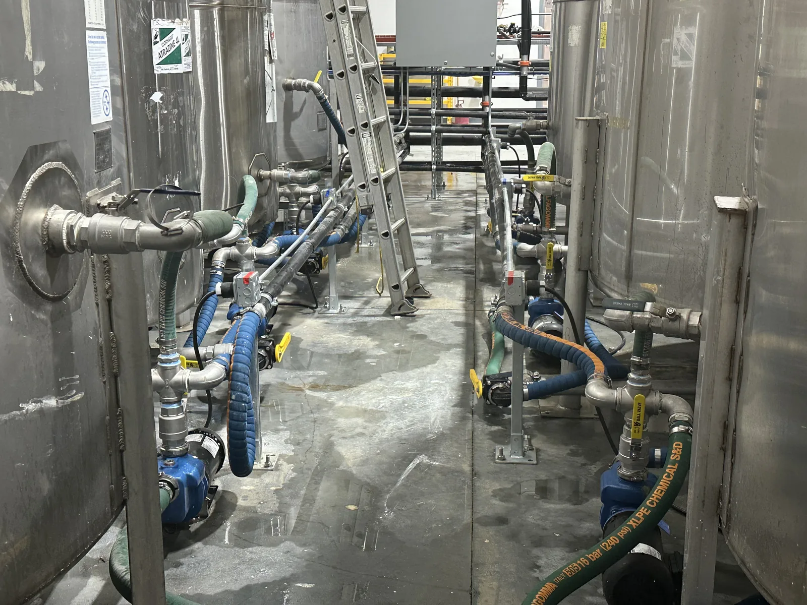 Pump and valve runs between the stainless bulk tanks