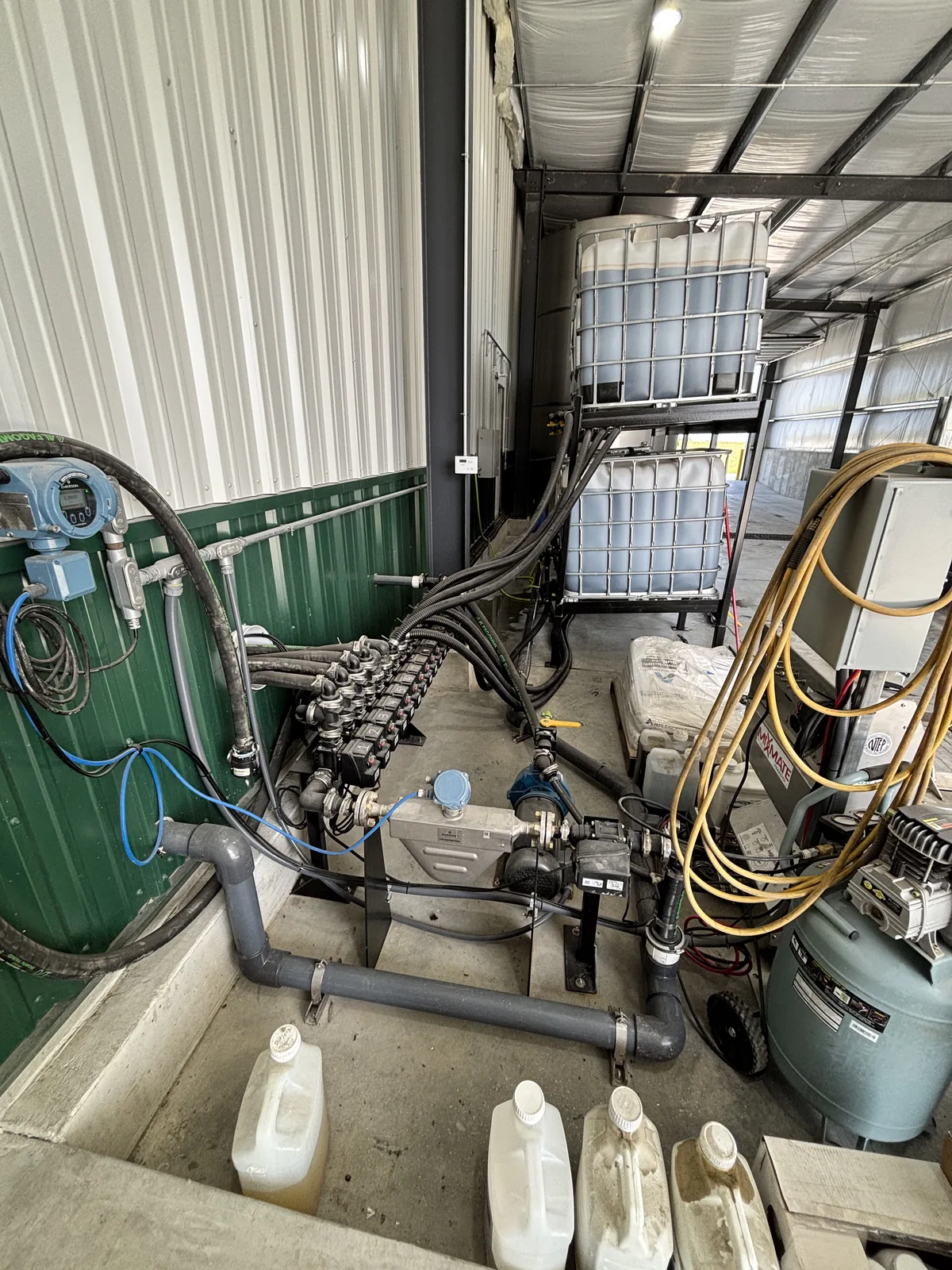 Stack, mass flow meter, and pump beside the tote rack