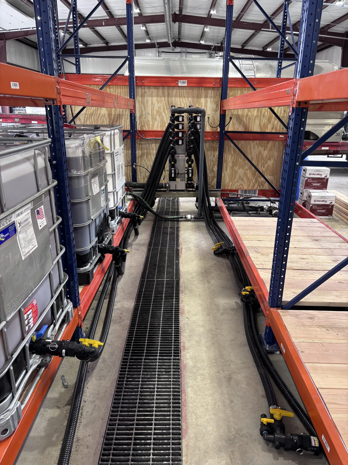 Tote bays plumbed to the stack down a floor drain aisle