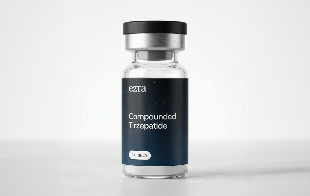 Clear vial with black cap labeled 'ezra Compounded Semaglutide RX ONLY' with a cloudy sky background on the label.