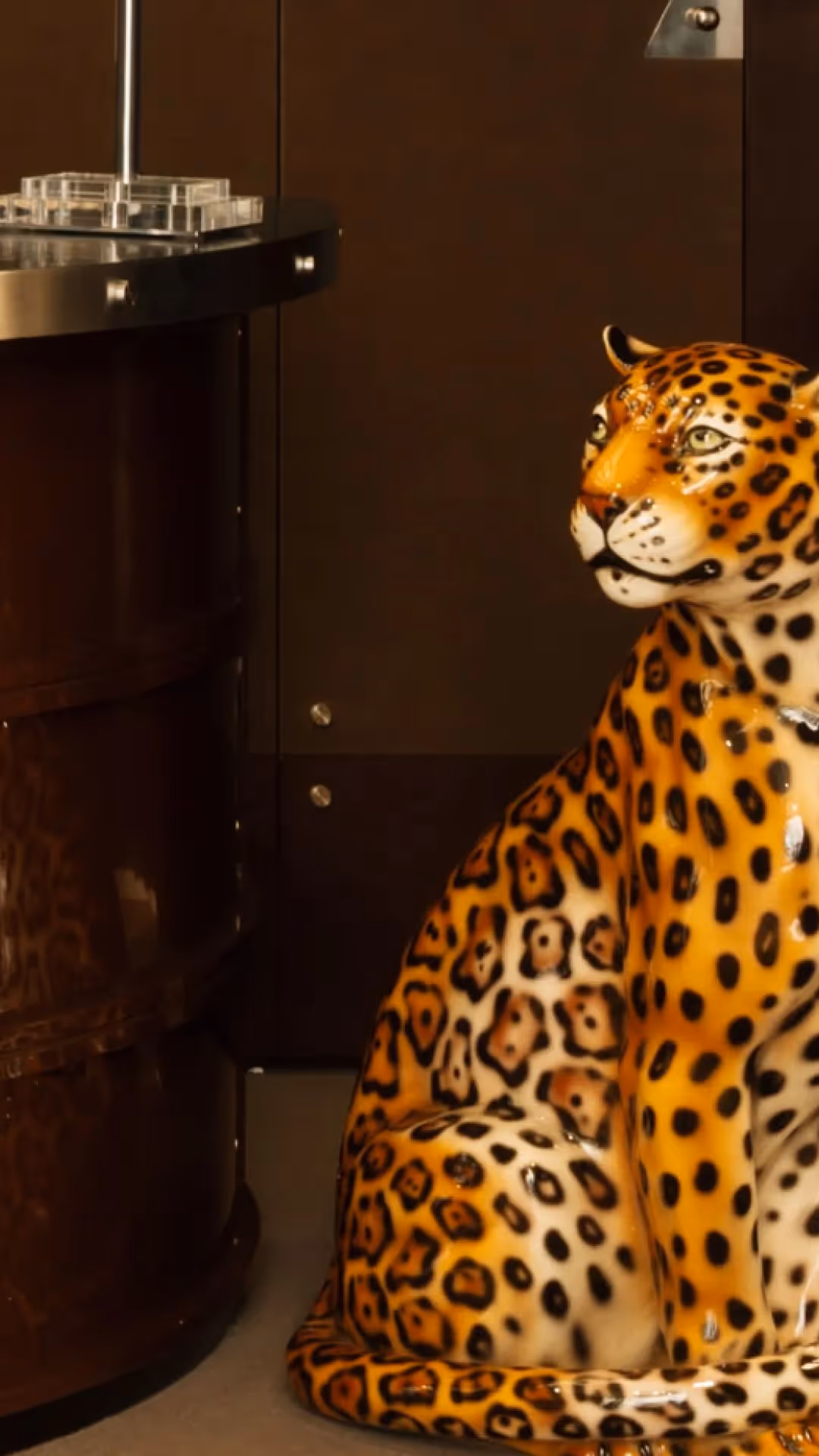 Close-up of a decorative ceramic leopard statue at the reception of the 4-star Hôtel Château d’Eau, Paris.