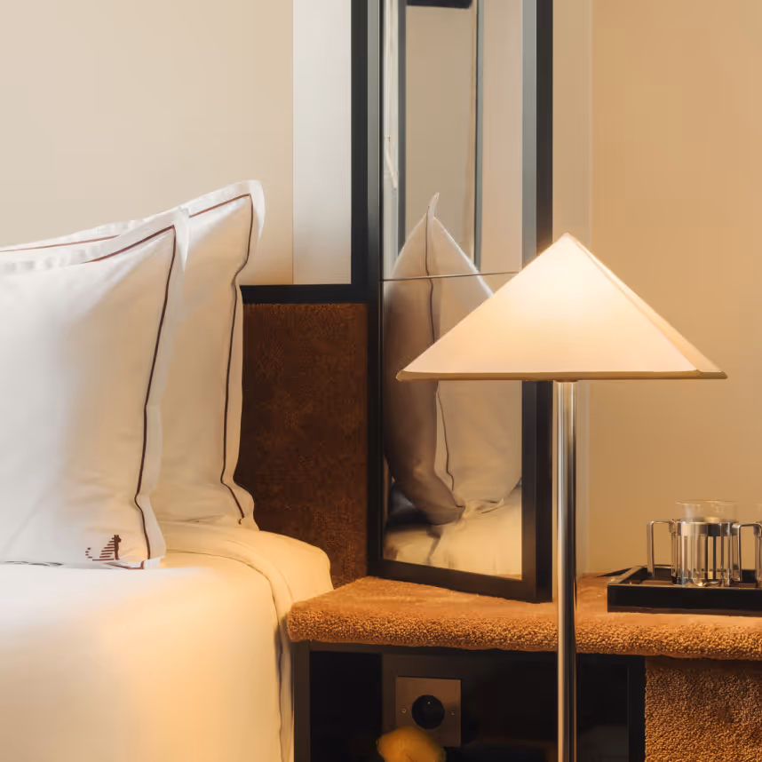 Retro detail: triangular lamp and pillows, four-star Hotel Château d’Eau, Paris Faubourg Saint-Denis.