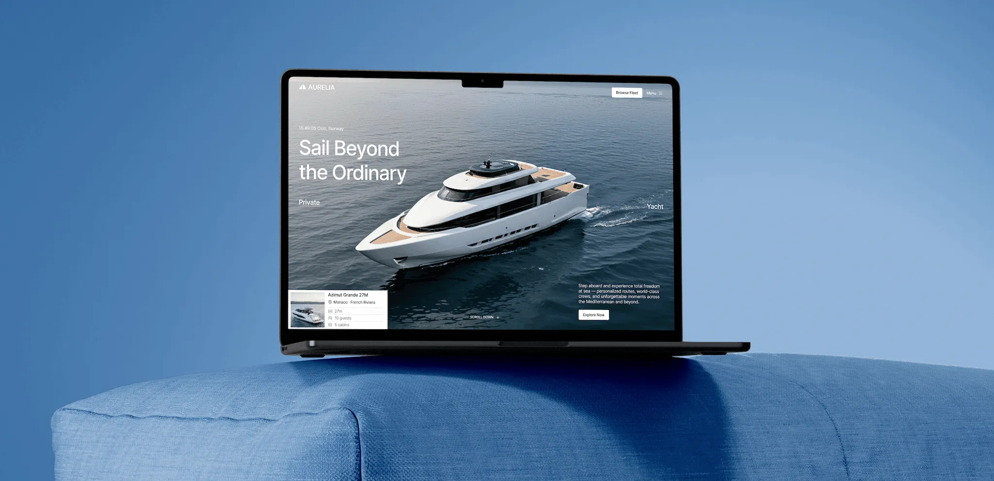 Open laptop on blue surface displaying a yacht on water with text 'Sail Beyond the Ordinary' and options to explore fleet.