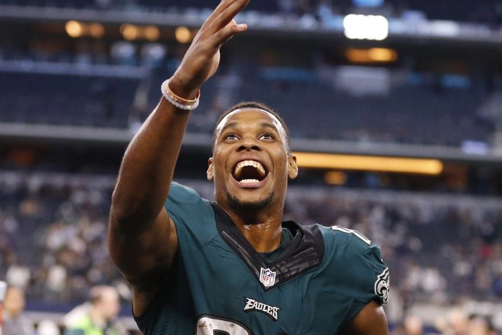Jordan Matthews shown celebrating by raising his hand and staring up in the sky in an Eagles jersey during his NFL playing days.