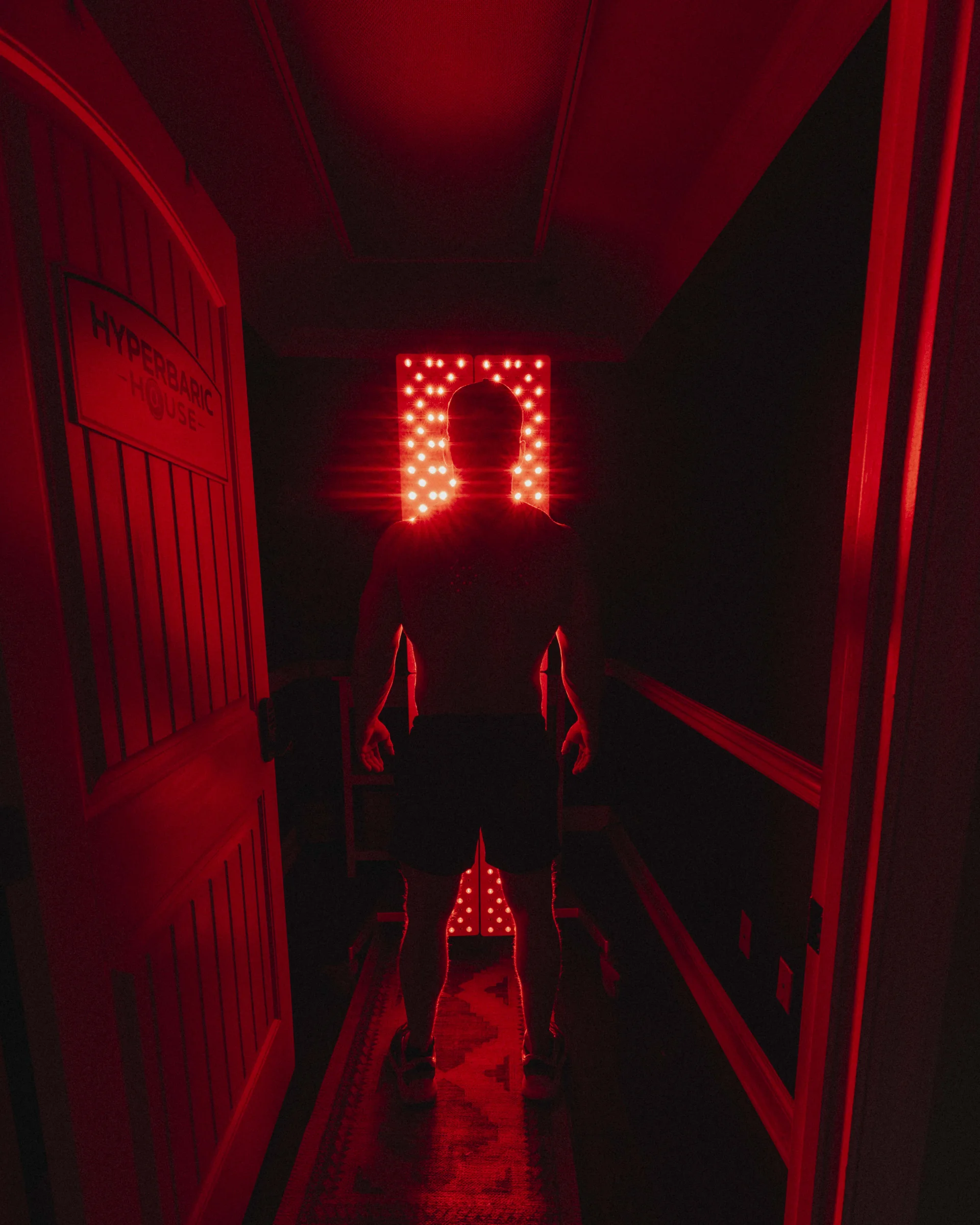 Hyperbaric House's red light therapy room in use - showing the large panels and therapy room.