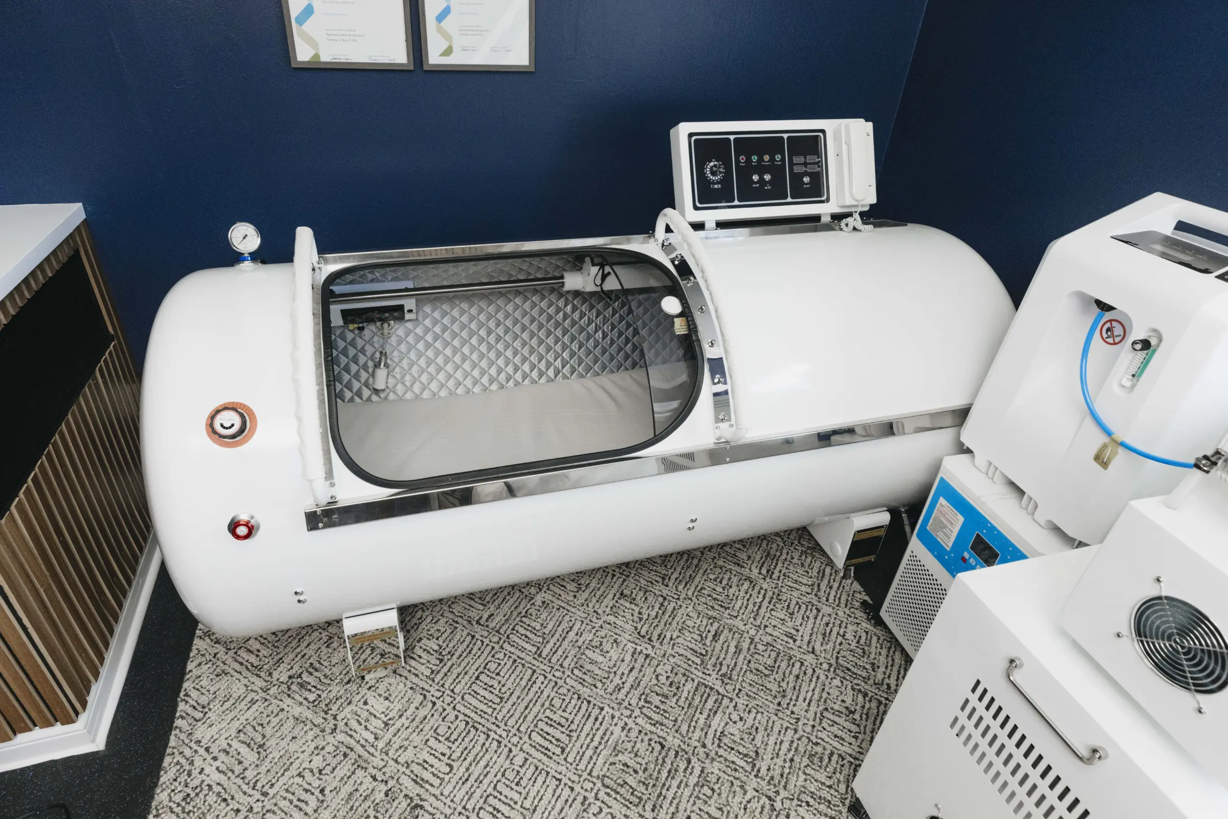 Hyperbaric House's medical 2.0 ATA hard-shell exterior with oxygen machine.