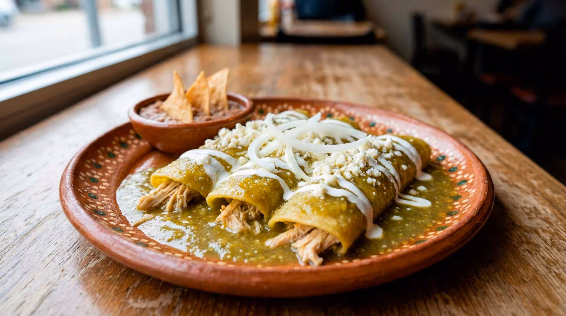 A plate of food with a green sauce on it.
