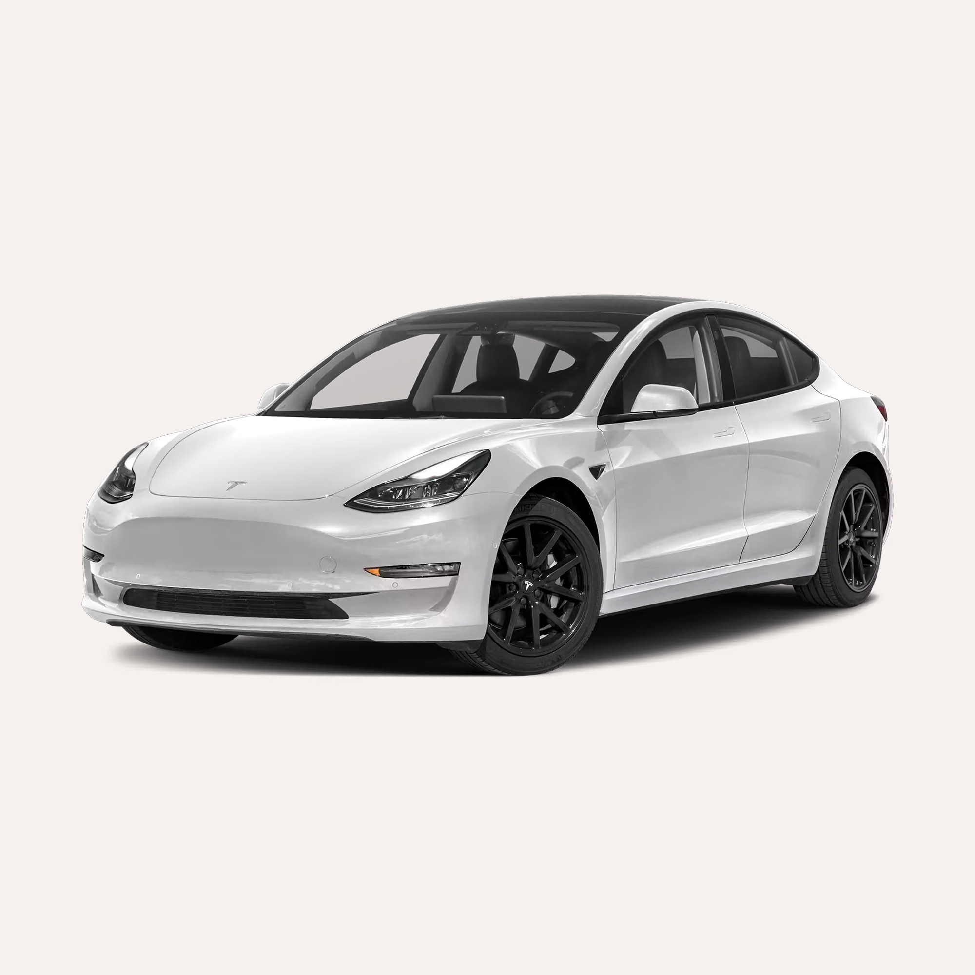 White Tesla Model 3 electric sedan with black wheels viewed from front passenger side.