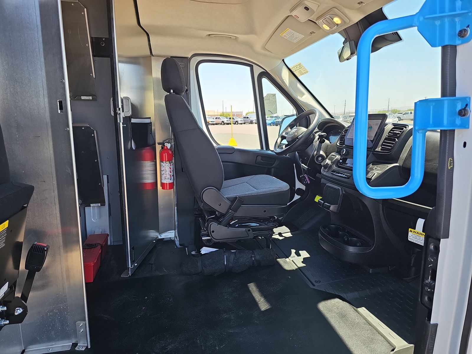 ProMaster EV cab interior with driver controls and safety tech
