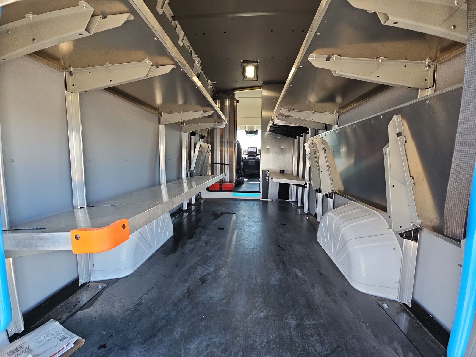 Cargo interior with modular aluminum shelving and EV-safe E-Floor