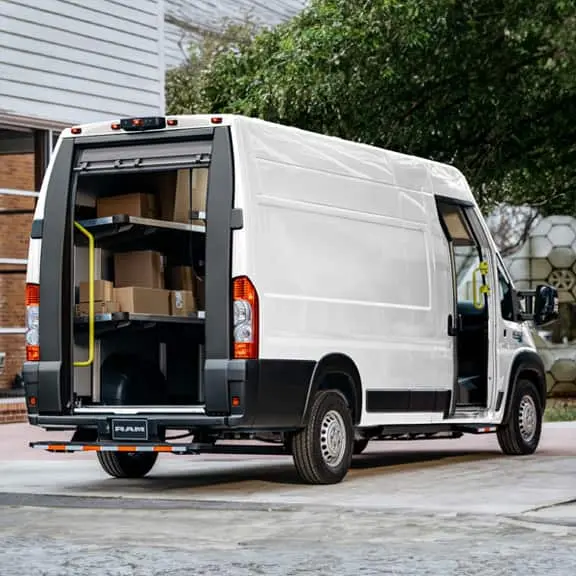 White Ram ProMaster EV with rear doors open, shelving loaded with packages