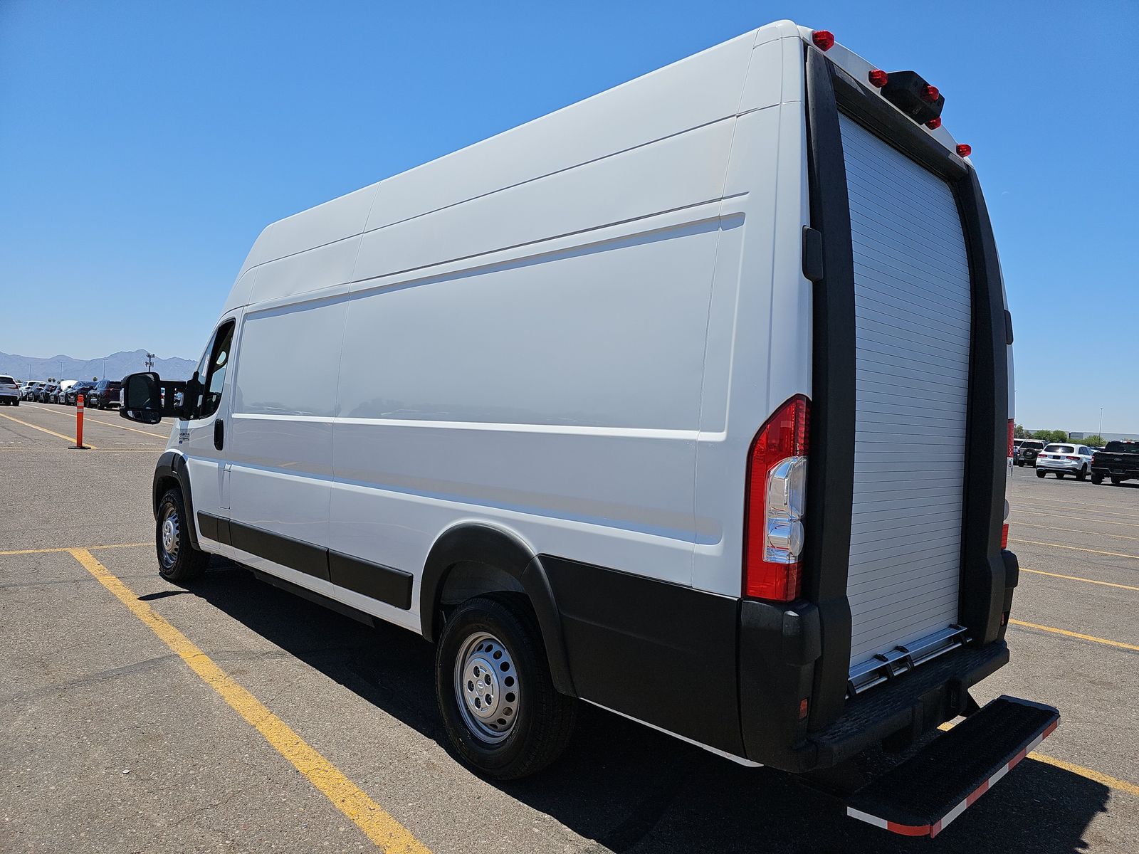 2024 Ram ProMaster EV high-roof cargo van, three-quarter rear view