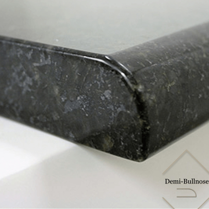 Close-up of a black marble countertop edge with a demi-bullnose profile.