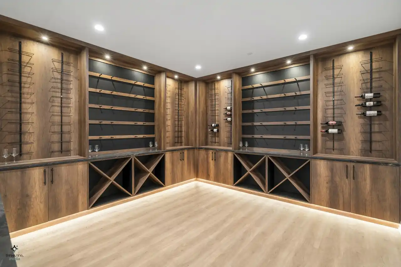 Custom wine cellar with built-in wood racking and bottle display shelving