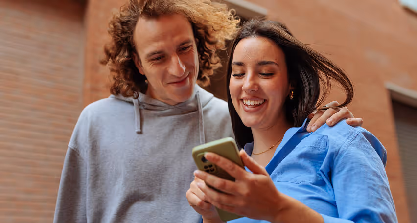 Couple looking mobile phone