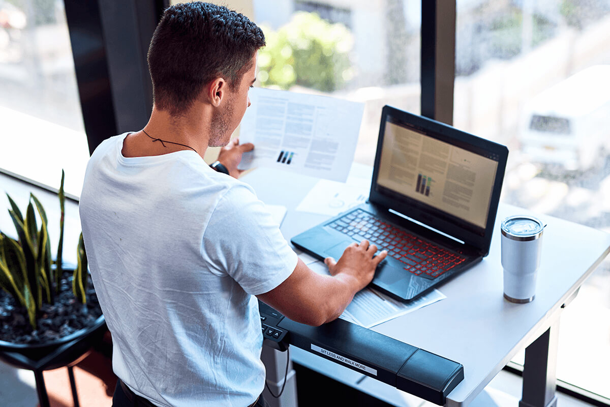 Person sitting at their desk at a computer