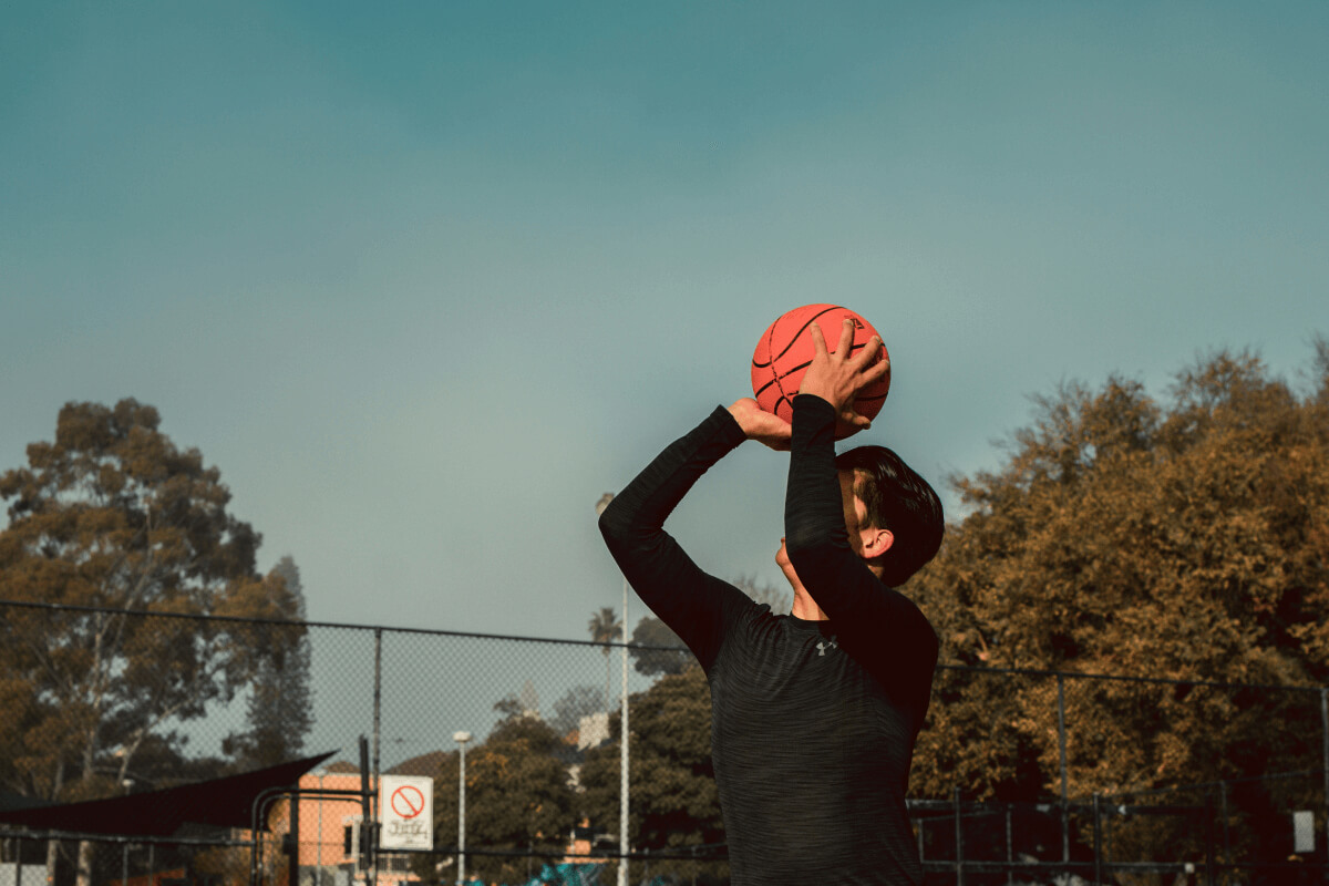 Person shooting a basketball