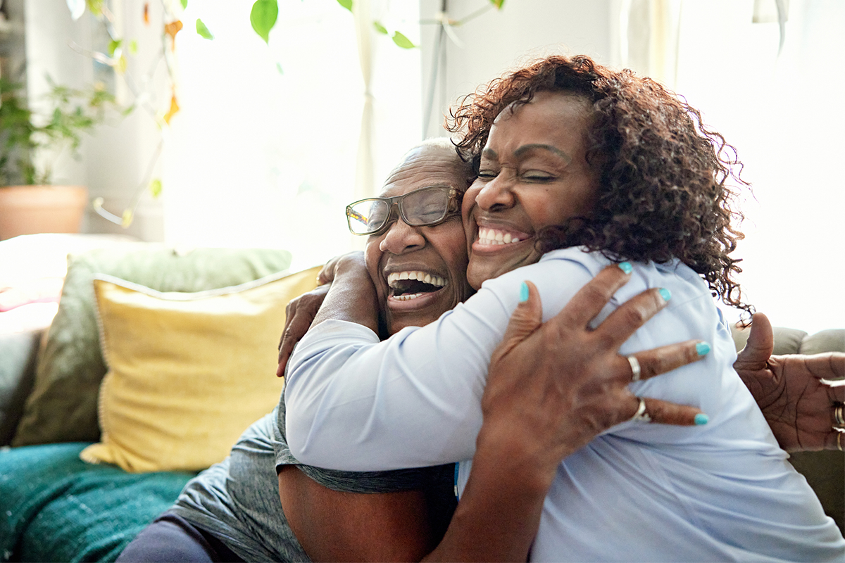 Two family members embracing each other in loving hug