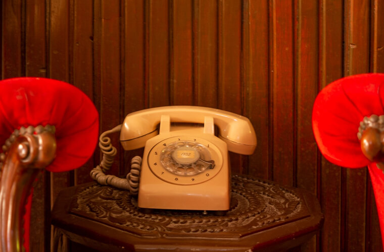 vintage rotary phone on a table