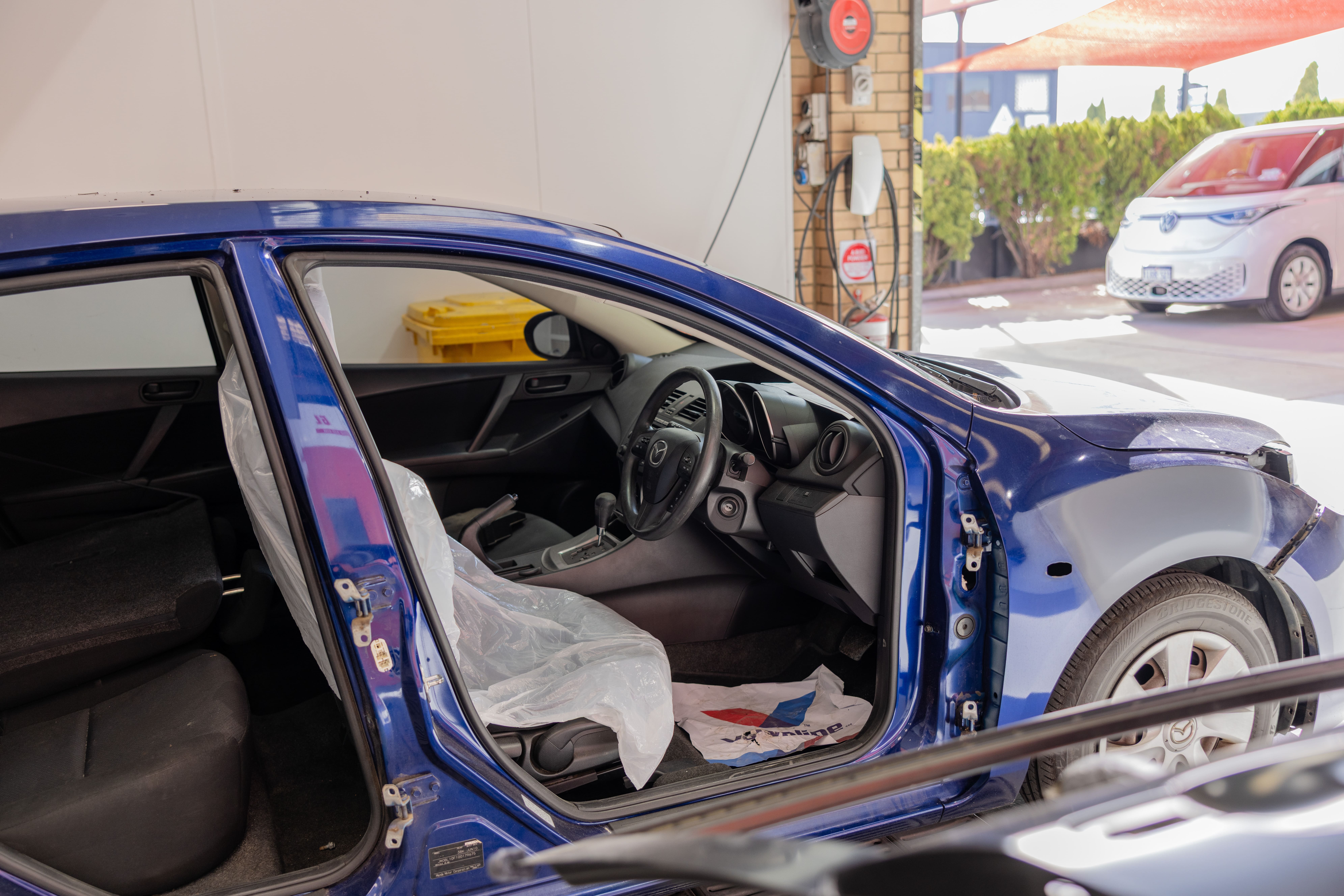Electric vehicle collision repair at EV Hybrid Smash workshop, Osborne Park