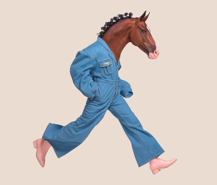 A horse's head on a human body walking mid-stride, wearing a denim jumpsuit and light pink boots.
