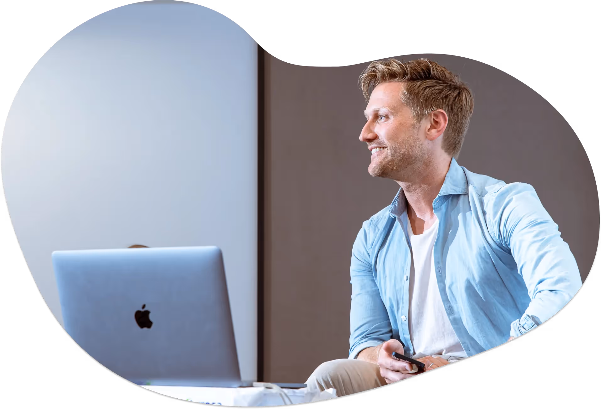 Tom Lavery sat behind a laptop, coaching a group in 2021