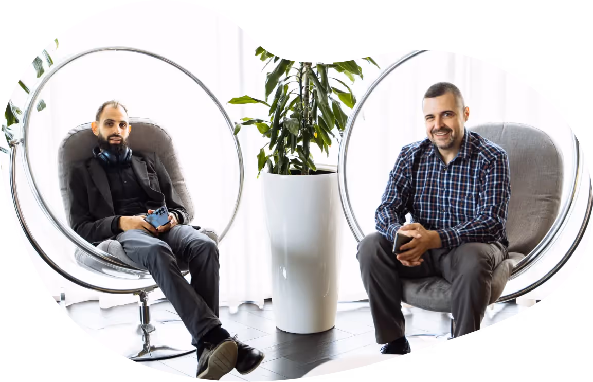 Employees from Jiminny's Bulgaria team sitting together working in modern office space