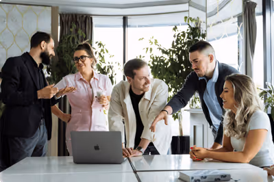 A team discusses using the MEDDIC sales methodology for tech sales in a modern office