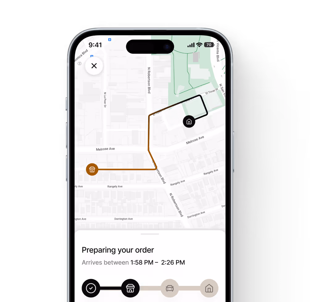 Smartphone screen showing a delivery tracking map with route lines and order status: Preparing your order, estimated arrival between 1:58 PM and 2:26 PM.