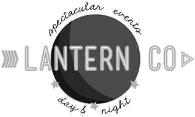 Logo with the words 'LANTERN CO' in large letters over a circular dark lantern illustration, surrounded by 'spectacular events' above and 'day & night' below in cursive.