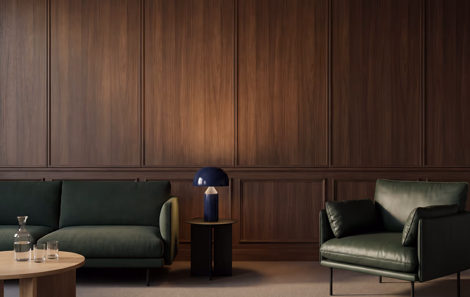 Modern living room with dark green sofa and armchair, wooden coffee and side tables, and dark wood paneled wall.