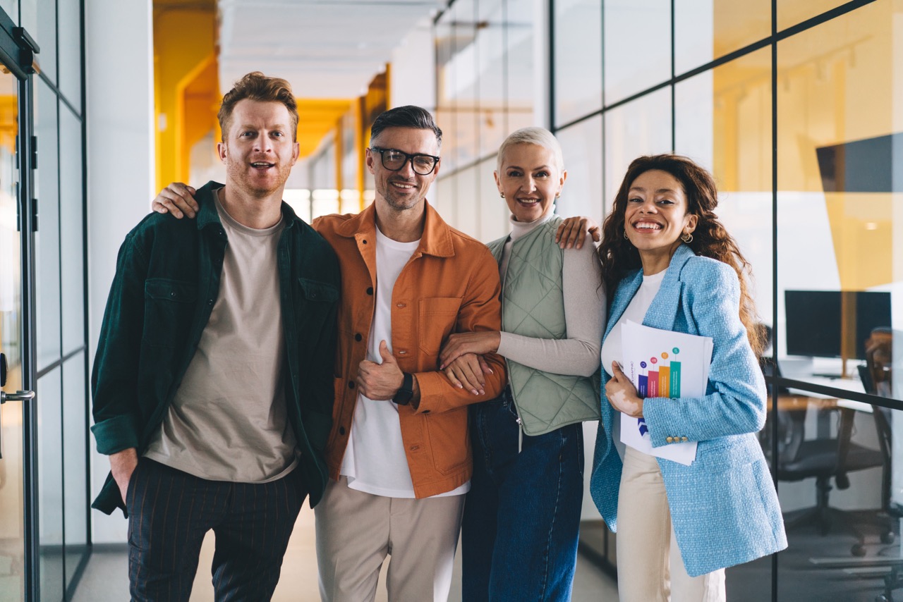 Diverse team of colleagues in an office supported by outsourced HR services