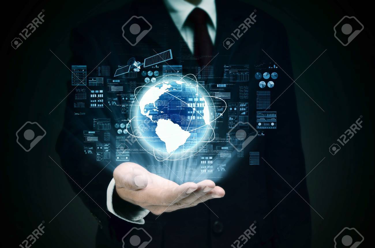 Businessman holding a glowing digital globe with data charts and a satellite hovering above it.