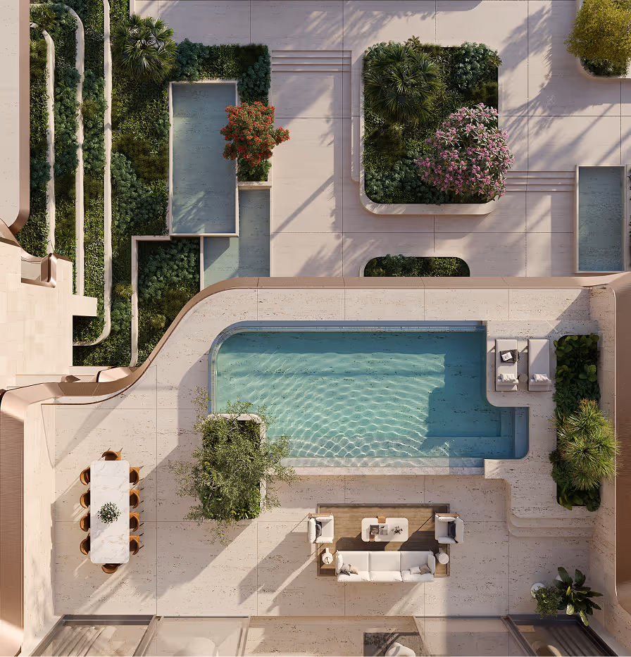 An aerial view of a swimming pool surrounded by greenery.