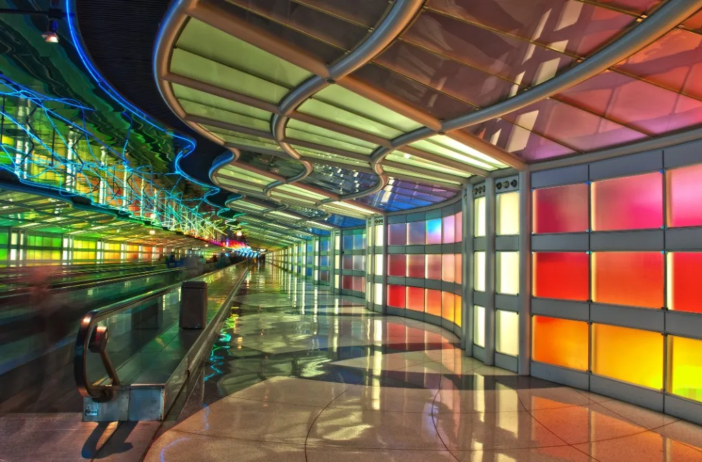 The neon-lit pedestrian tunnel between concourses at O'Hare International Airport