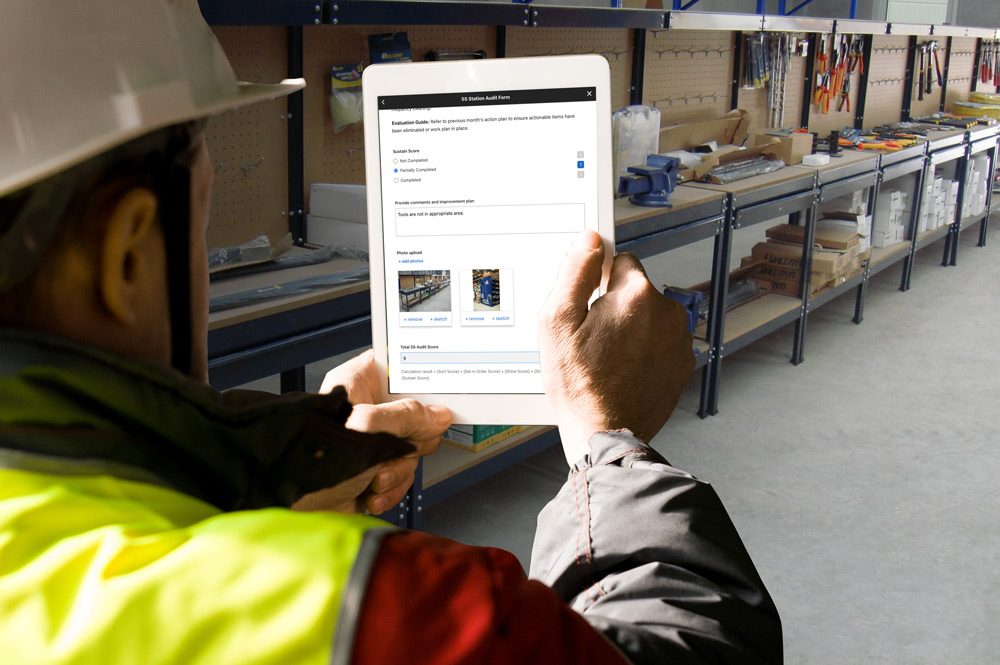 5S-audit-person-taking-photo-using-tablet-of-5S-area