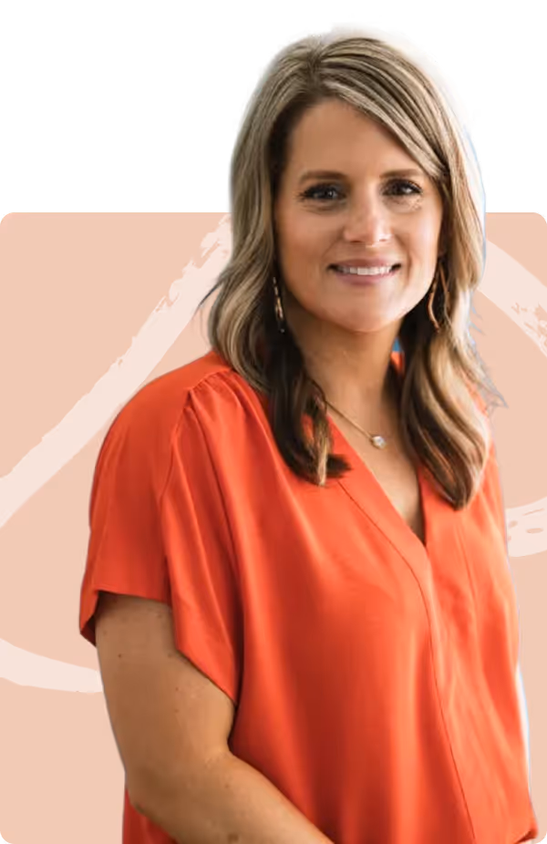 Smiling woman with blonde hair wearing a red blouse and gold hoop earrings.