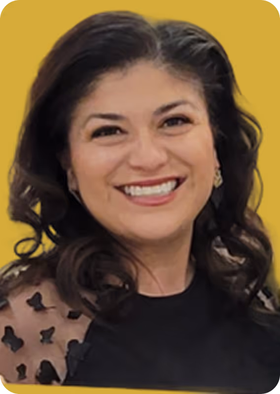 Smiling woman with dark curly hair and a black top against a yellow background.