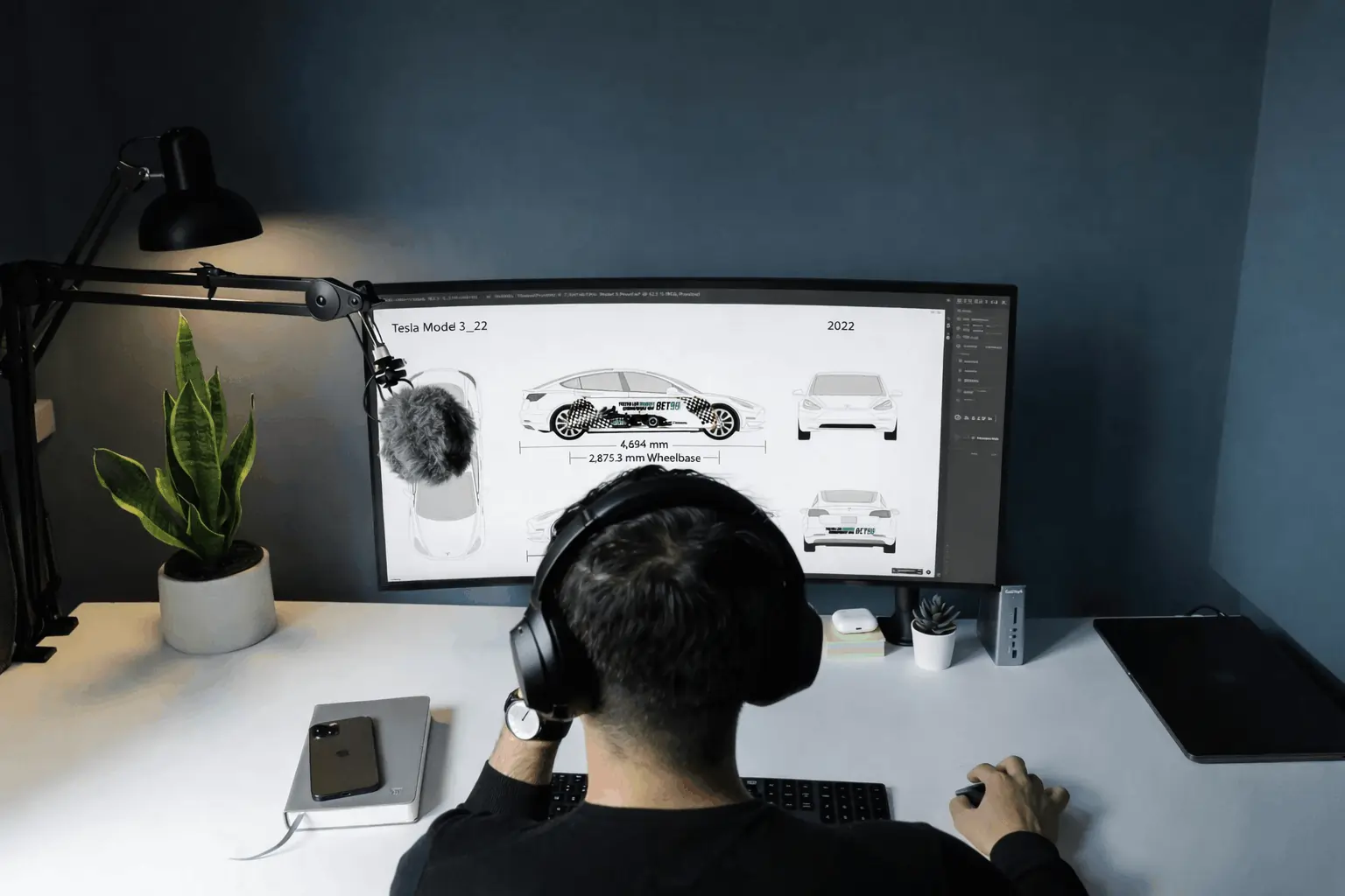 A graphic designer developing car wrap creative