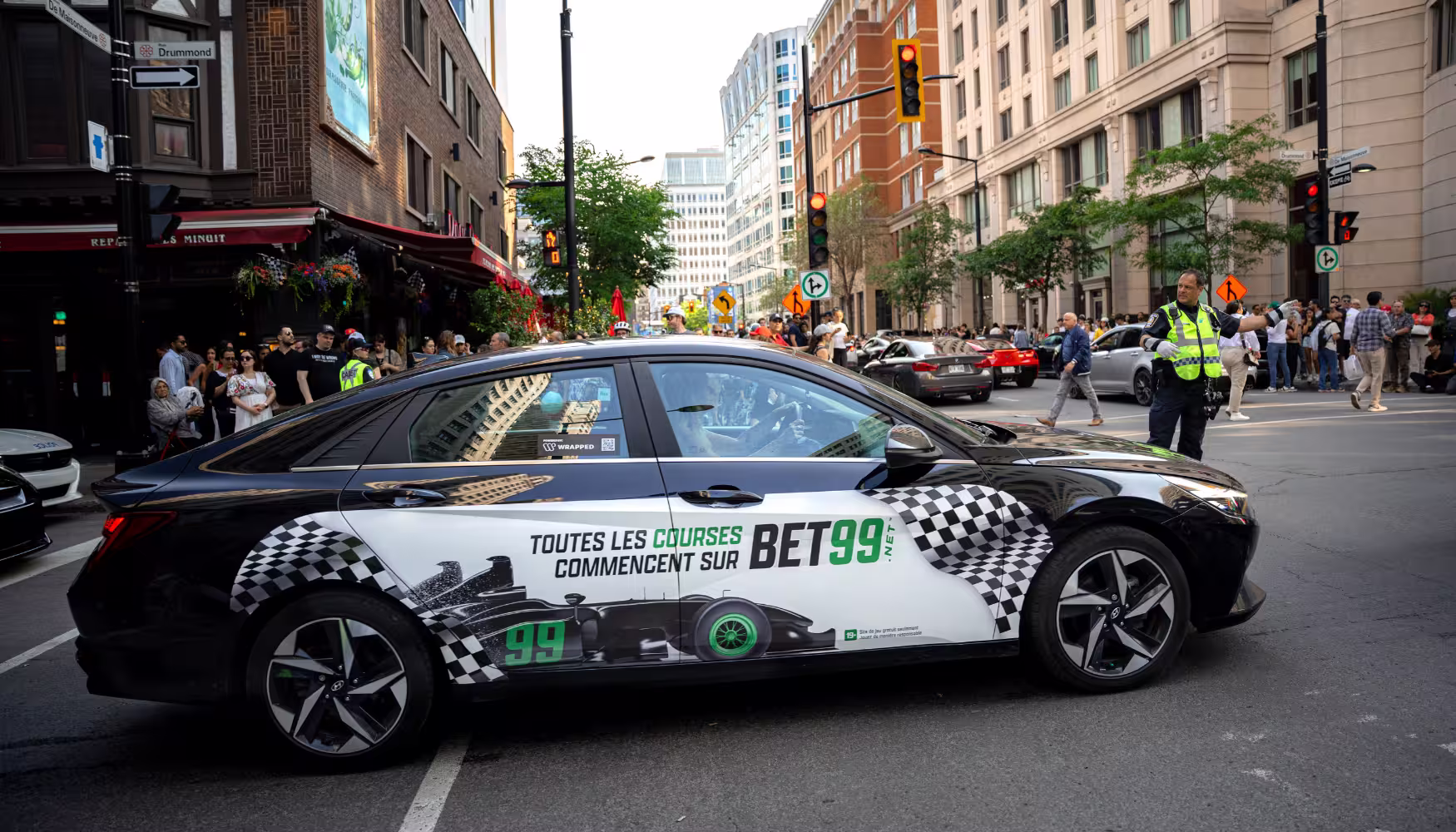 BET99 wrapped car SWARMing a busy street