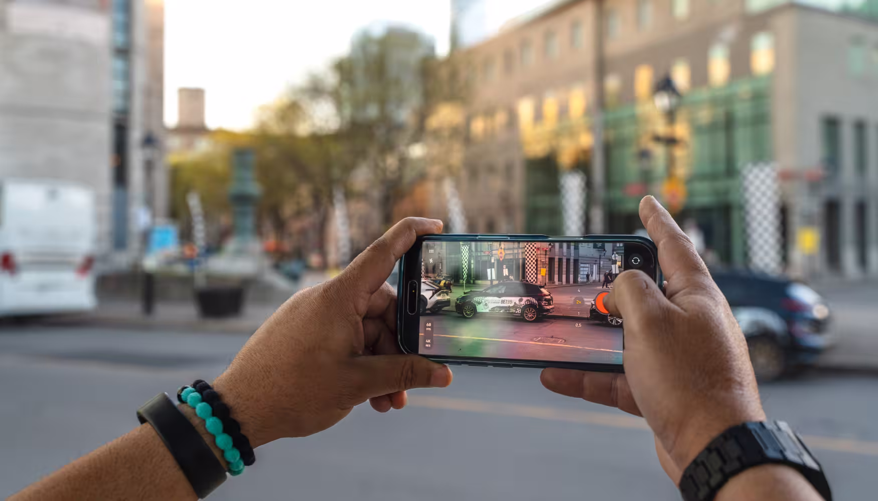 Someone taking a video of a wrapped car