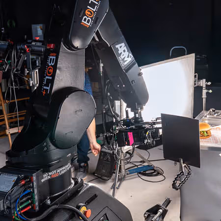 Bolt Jr+ on track filming a tv commercial for a fast food burger chain