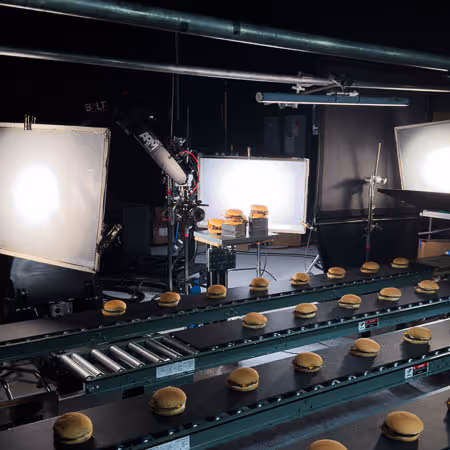 Bolt Jr+ on track filming a tv commercial for a fast food burger chain