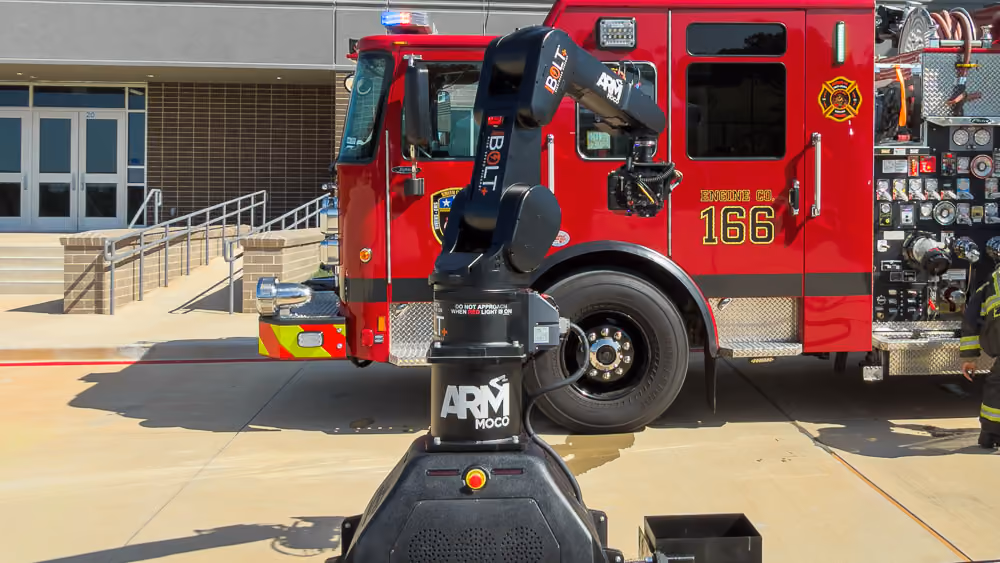 A MRMC Bolt Jr+ on track in front of a fire truck
