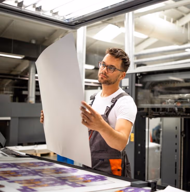 Man holds form film in factory