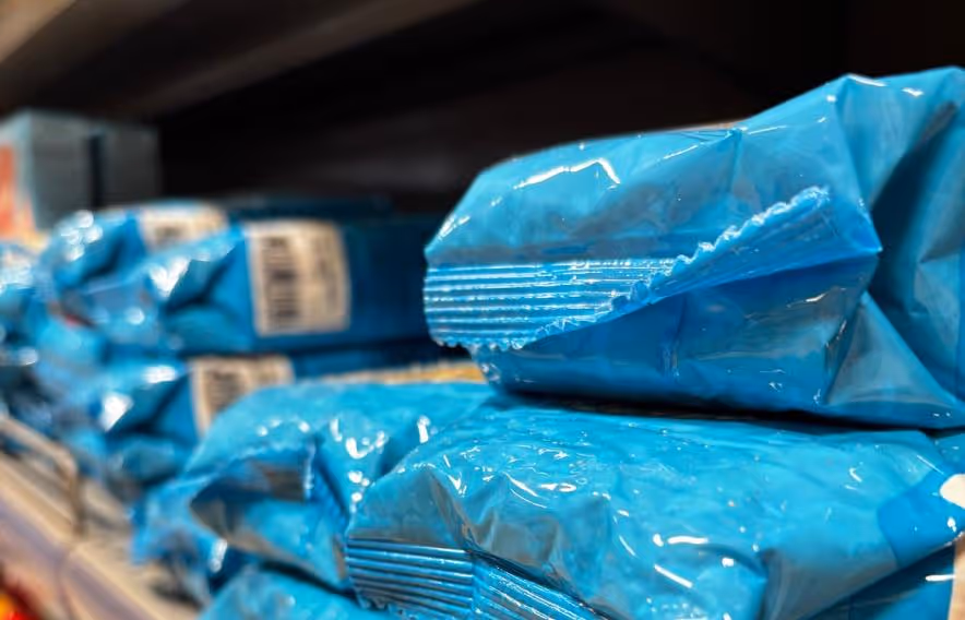 Blue packets on shelf