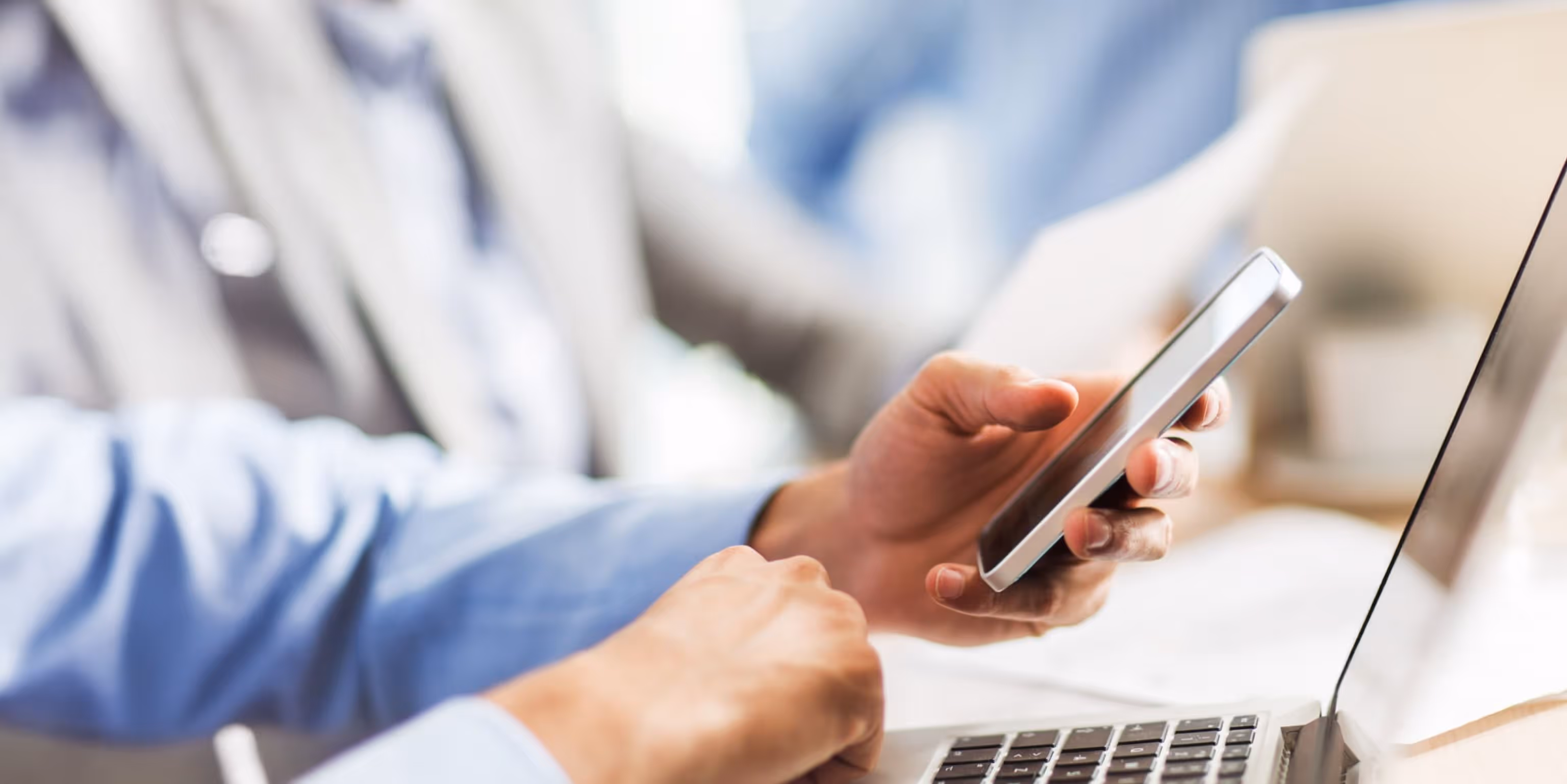 Hand touching laptop screen