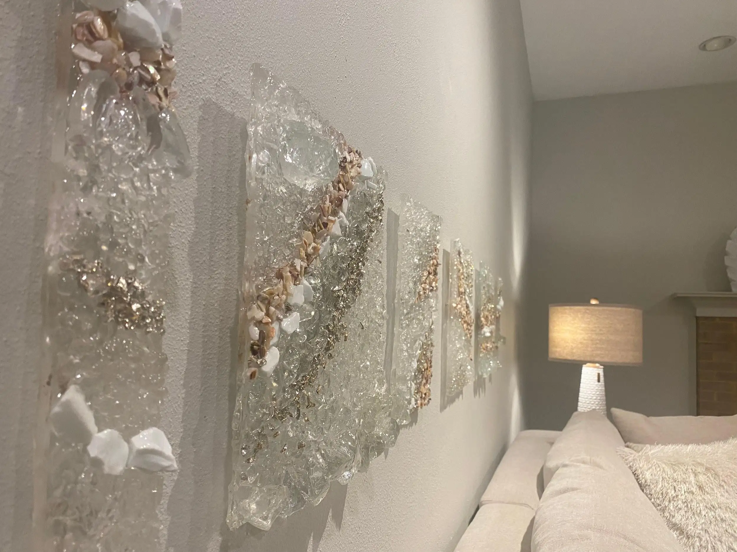 Luminous decorative stones, home interior, behind the sofa on a white wall